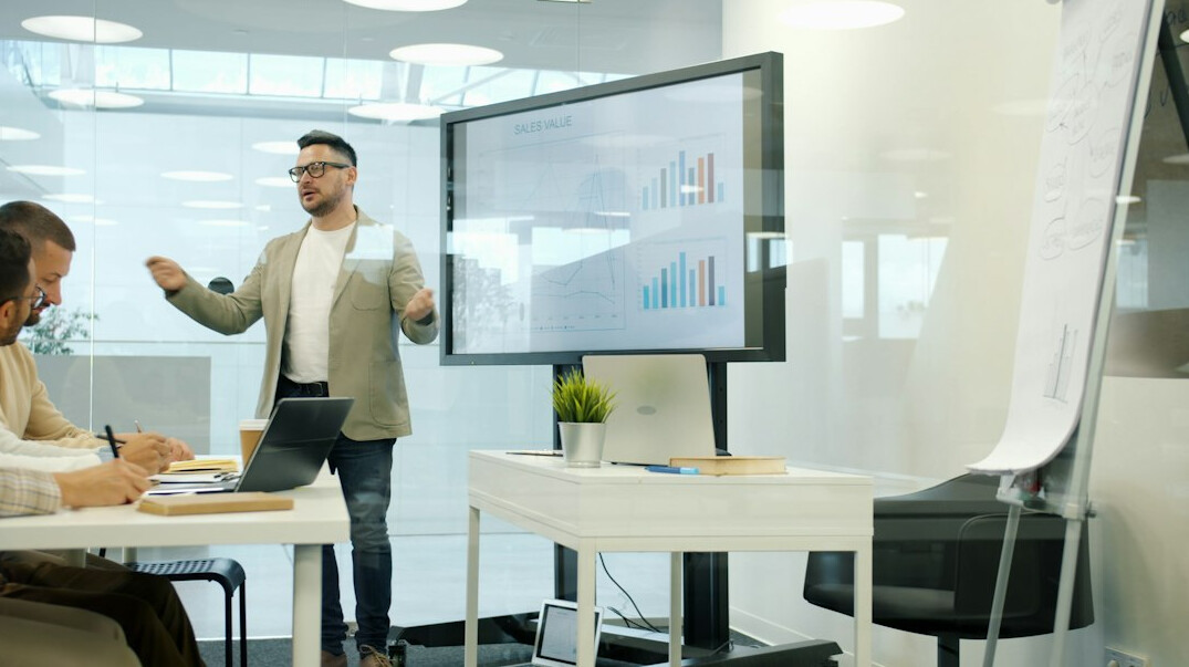 man presenting at conference