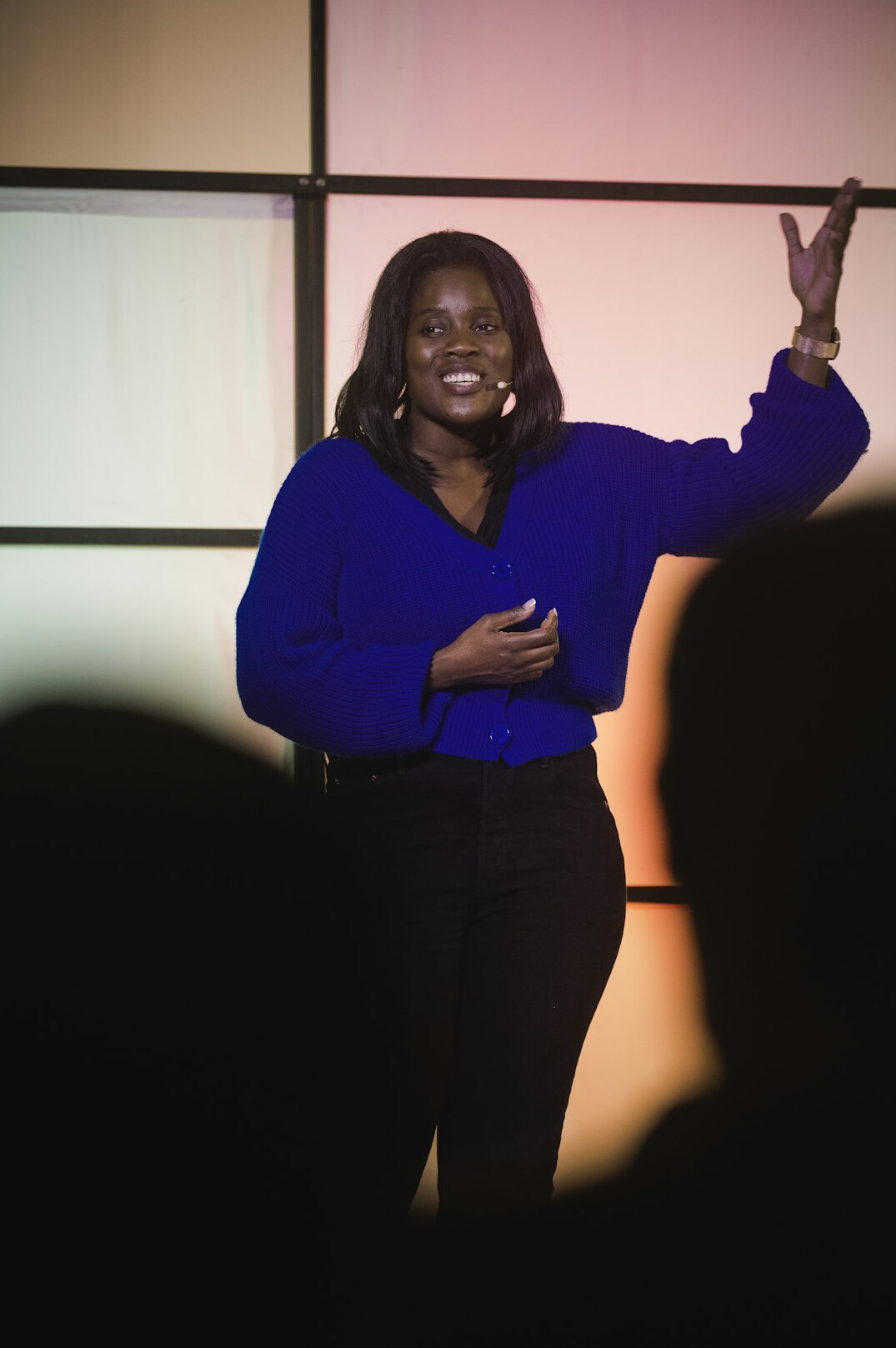 woman speaking confidently on stage